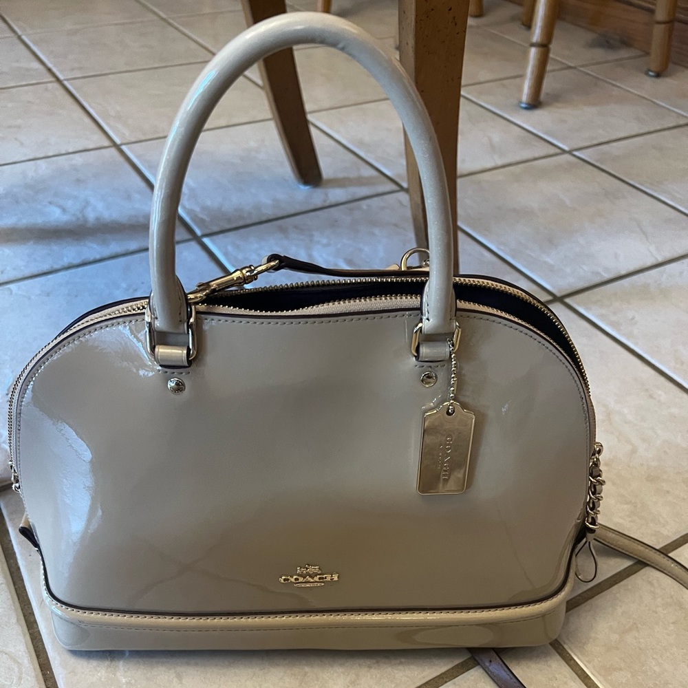 Coach NWOT Genuine Patent Leather bag in light tan/cream.